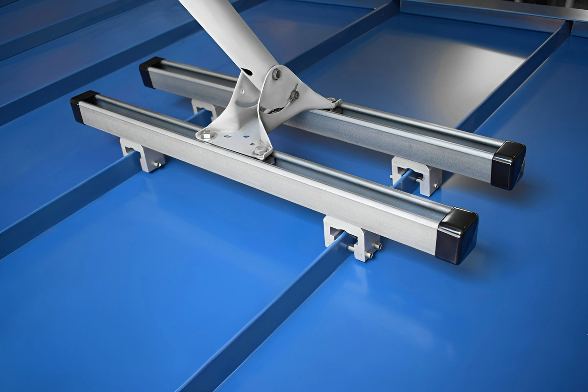 SataMount MRM installation mounted on a blue screw-down metal roof with two rails and a satellite mast bracket